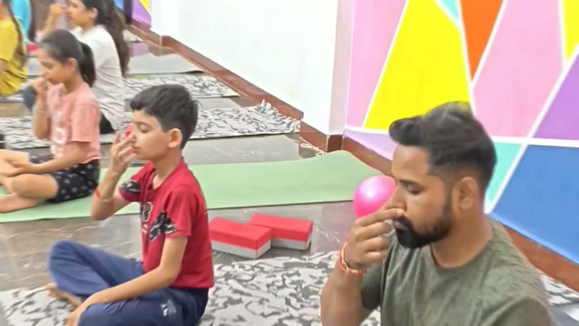 Pranayama practice — kids aur adults ek saath